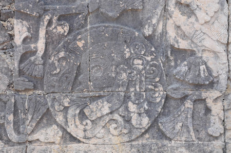 Chichen Itza, Quintana Roo, Mexico. June 01, 2011: Intricate Mayan carvings on a stone wall at Chichen Itza, Mexico.の写真素材