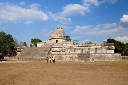 Chichen Itza, Quintana Roo, Mexico. June 01, 2011: Tourists explore the ancient ruins of the observatory at Chichen Itza, Mexico.の写真素材