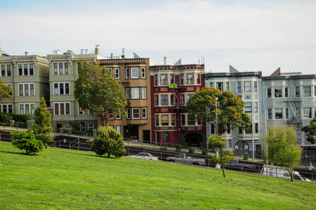 San Francisco, CA, USA. April 24, 2012: Painted Ladies in San Francisco with lush green park in the foreground.の写真素材