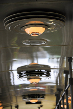 Vintage lighting inside retro San Francisco streetcar reflecting on ceilingの写真素材