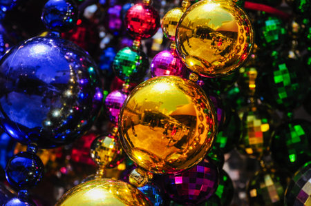 Colorful metallic beads shimmer in vibrant shades, creating a festive scene