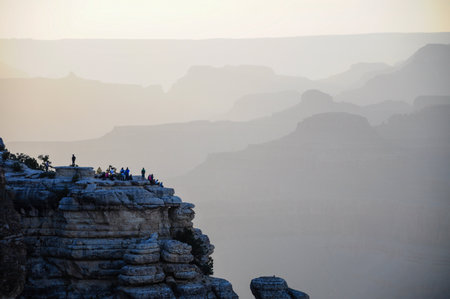 Adventurers enjoying misty morning at iconic Grand Canyon National Park