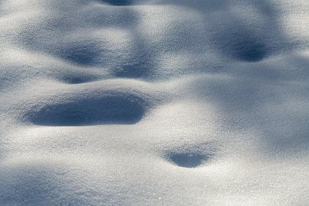 The snow is very white and the ground is covered in itの写真素材