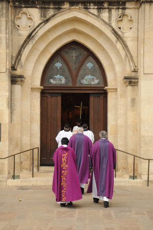 San Antonio, Texas, USA. March 16, 2013: Clergy in purple robes entering a stone church for a...