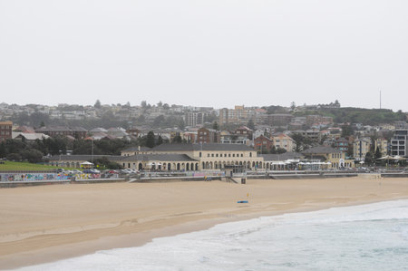 Tranquil Bondi Beach with overcast skies and gentle waves for a peaceful dayの写真素材