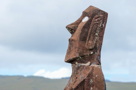 Moai statue overlooking serene Easter Island landscape, Chile.の写真素材
