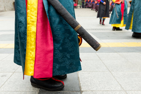 Traditional Korean attire at Deoksugung Palace cultural ceremonyの写真素材