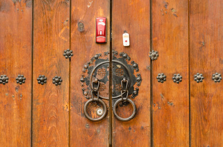 Wooden Door with Brass Ornaments in Bukchon Hanok Village, Seoulの写真素材