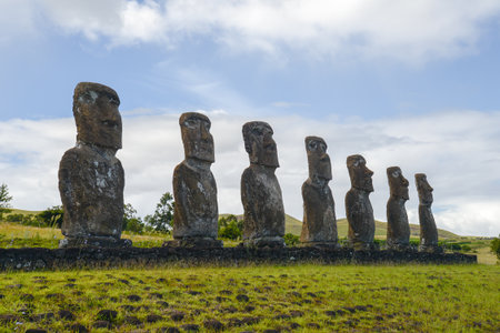 Ancient moai statues under cloudy sky on Easter Island, Chileの写真素材