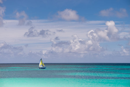 Sailboat on Turquoise Waters of Bay East Under Blue Skyの写真素材