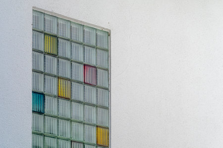 Colorful windows on the wall of a building, close-up