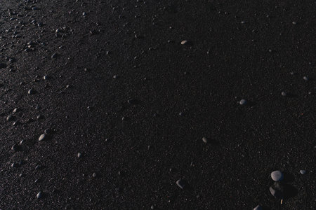 Black volcanic sand with small pebbles in Iceland. Close up.の写真素材