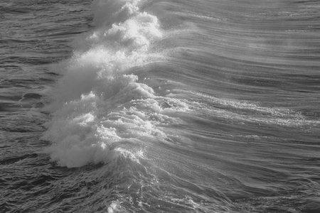 Waves breaking on the shore of the Atlantic Ocean. Toned.の写真素材