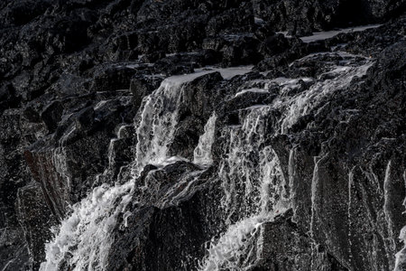 Icelandic nature. Ice and snow on the rocks in Iceland.