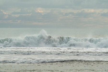 Sea waves breaking on the beach in the evening. Landscape.の写真素材