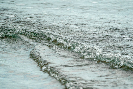 sea waves on the beach, shallow depth of field. soft focusの写真素材