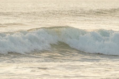 Beautiful wave on the sea at sunset time. Close up.
