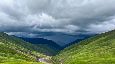 Beautiful landscape with mountains and cloudy sky. Panoramic viewの写真素材