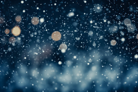 Winter snowfall overlays dark background with defocused white circles textureの素材