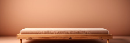 A clean minimalist wooden bed frame isolated on a brown gradient backgroundの素材