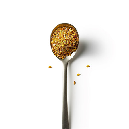 A single golden flaxseed on a minimalist spoon isolated on a transparent backgroundの素材