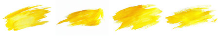 Set of four vibrant yellow brush stroke banners on a white background with space for text, ideal for creative projects and graphic designsの素材