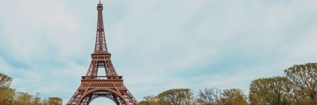 Springtime panoramic view of the Eiffel Tower in Paris, France, with clear blue skies on Bastille Day, April 14th, 2024, ideal for travel and holiday themesのeditorial素材