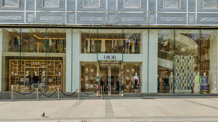 Elegant Dior boutique front in Paris, France, showcasing luxury fashion, reflective of consumer culture and haute couture, photographed on April 14th, 2024のeditorial素材