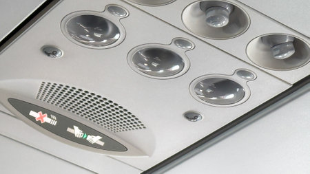 Cabin ceiling encapsulates the lull of flight, evoking aviophobia therapy and International Civil Aviation Day dreamsの写真素材