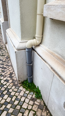 Stoic pipes embrace corners whimsy, urban growth festival, hidden geometries of cobblestone narratives, edge of an alchemists alleyの写真素材