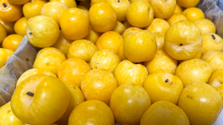 Golden jujube bounty gleams like miniature suns, invoking the Mid Autumn Festival's abundance and unexpected tangy delightの写真素材