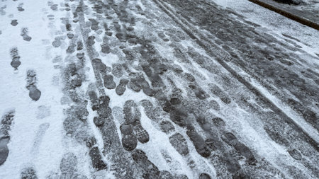 Chilled footsteps etched in whispering snow, hint at secret wanderings, evoking Winter Solstice reflections and Frosty Footprints Dayの写真素材