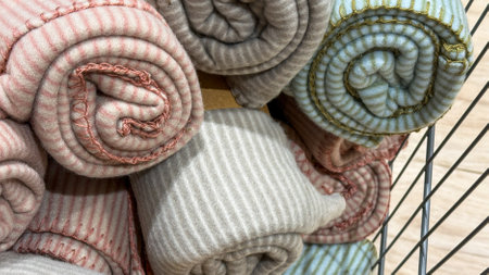 Cozy rolled blankets, pastel rhythms invoke hygge warmth, perfect for Lunar New Year gifting or winter solstice serenityの写真素材