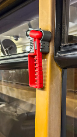 Vibrant red emergency hammer awaits action, evoking energy and World Safety Day focus on protection