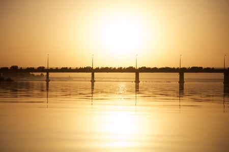 Pont des martyrs Bridge in Bamako on the river the Niger with a beautiful sunset with people, cars and motorbikesの写真素材