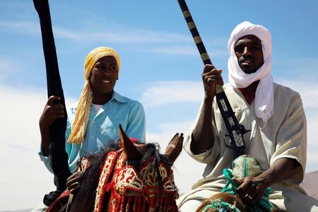 Moroccan riders on the road to marrakech close to the city of Tata in Moroccoのeditorial素材
