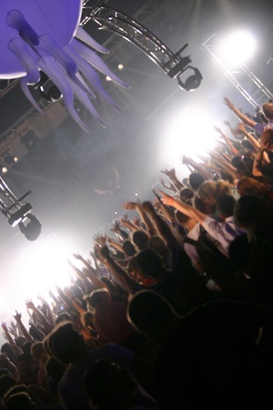 People jumping and dancing during a live concertのeditorial素材