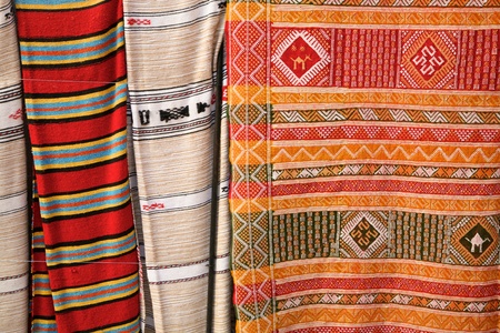 Selection of wonderfully bright colourful cloth at a market stall in Fez, Morocco