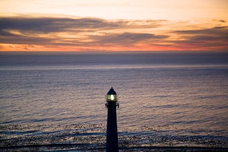 Lighthouse in the sea at simons town during a beautiful sunset.の写真素材