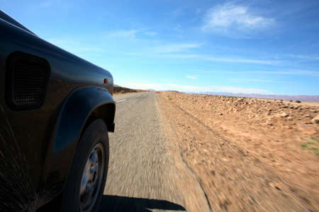 A four wheel drive car on a road ...