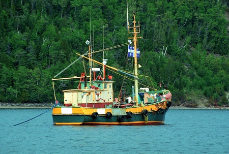 Old fishing boat anchored near Tadousac - Canadaのeditorial素材