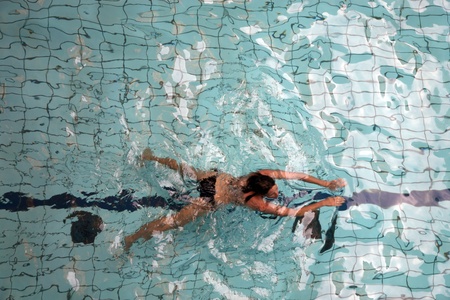 Someone swimming in the SzeÌchenyi Thermal Bath in Budapest City Park のeditorial素材