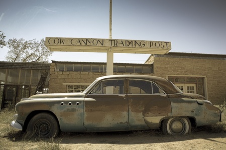 Old abandoned car at the Twin rocks in the Utah, toned imageのeditorial素材