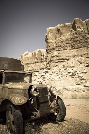 Old abandoned car at the Twin rocks in the Utah, toned imageのeditorial素材