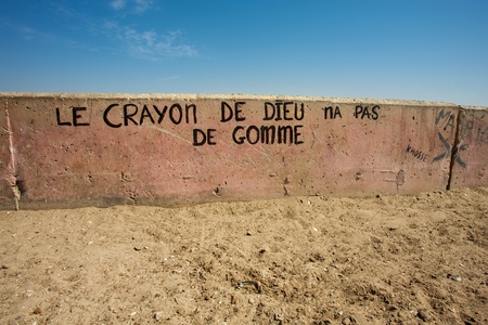 Message on a wall saying that the pencil of god has no gum eraser in Saint Louis, Senegal, 2010の写真素材
