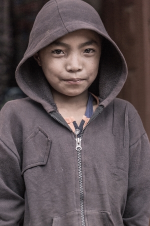 NEPAL, BHAKTAPUR, APRIL 23: portrait of a young kid looking at the camera, living in Bhaktapur, April 23, 2013, Bhaktapur, Nepalのeditorial素材