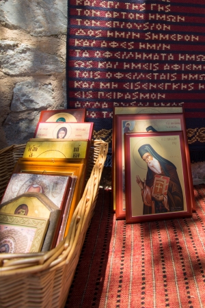 Religious Icons for sale at entrance of a church in Santorini, Greece,