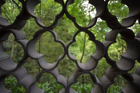 Close-up of a temple fence in the forest in Hangzhou, Chinaの写真素材