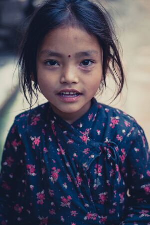 BHAKTAPUR, NEPAL, APRIL 24  unidentified girl dressed with a traditional nepalese shirt, Bhaktapur, Nepal, 2013のeditorial素材