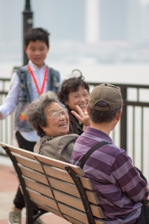 SHANGHAI, CHINA, APRIL 29  unidentified members of the same family walking along the river, very popular in Shanghai on Sundays, China 2013 のeditorial素材